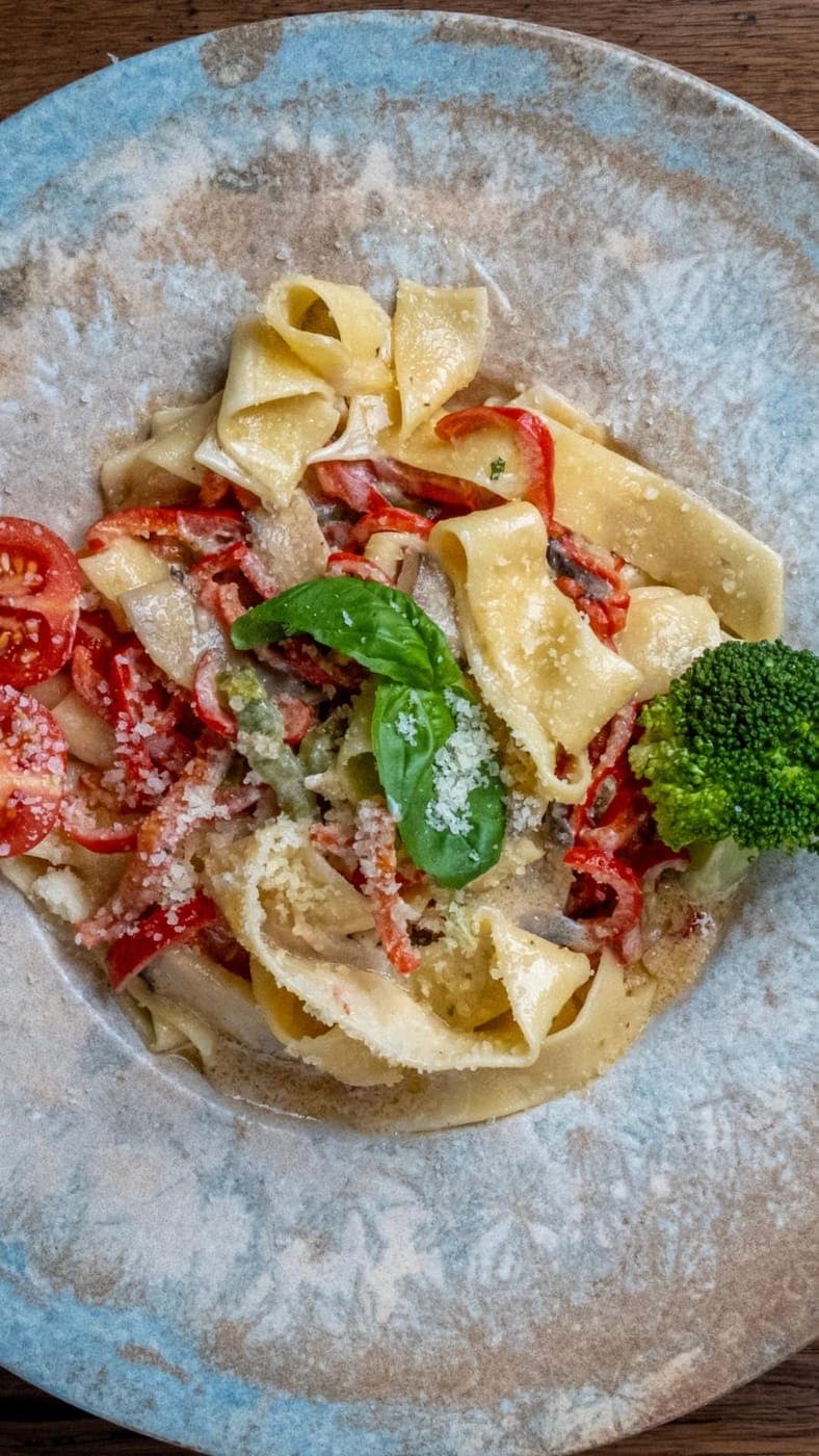 Fresh pasta with tomato and basil